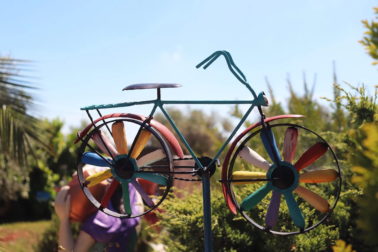 Illustrated wind-chimes made from recycled tins