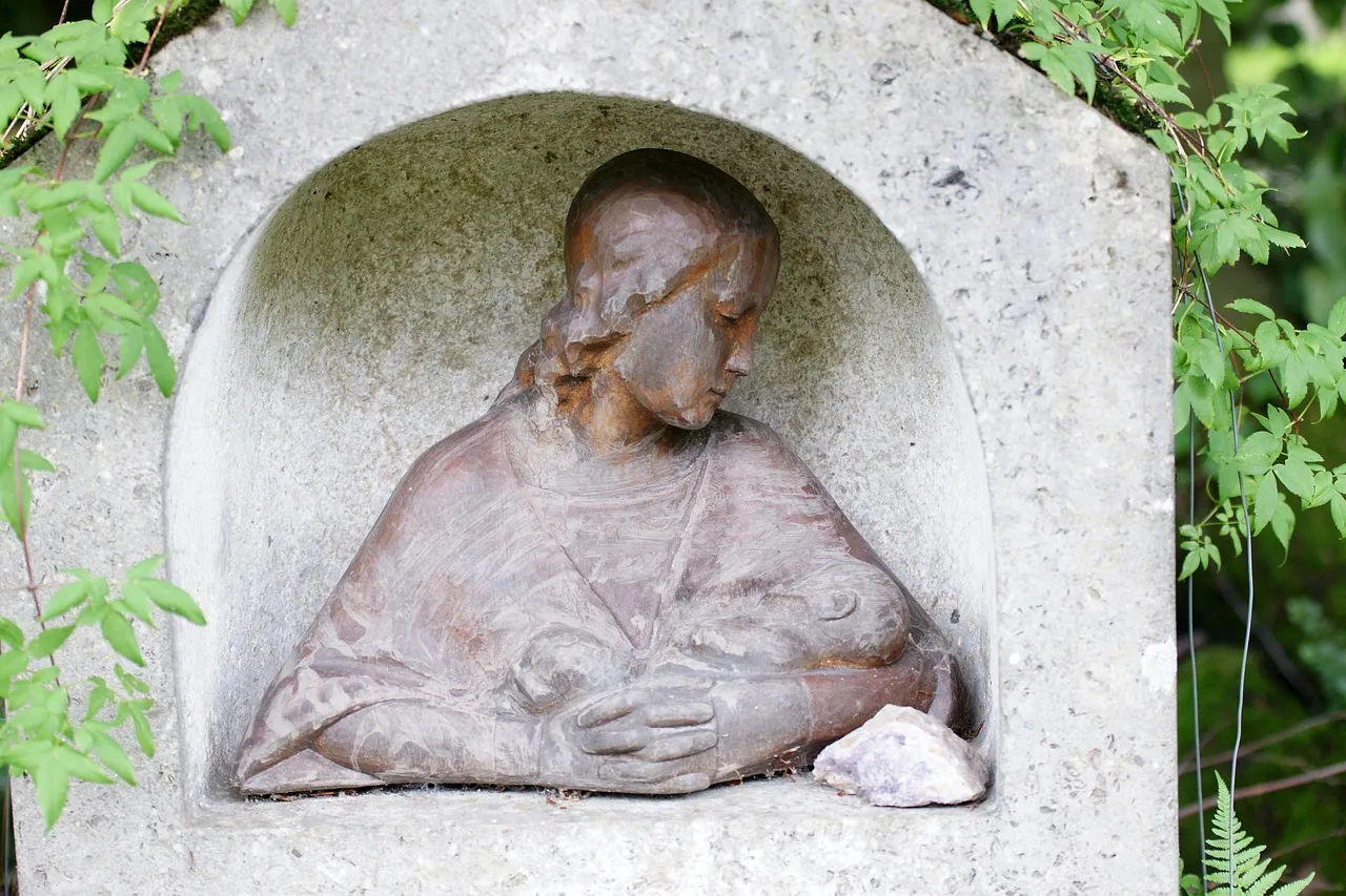 A child holding a painted stone