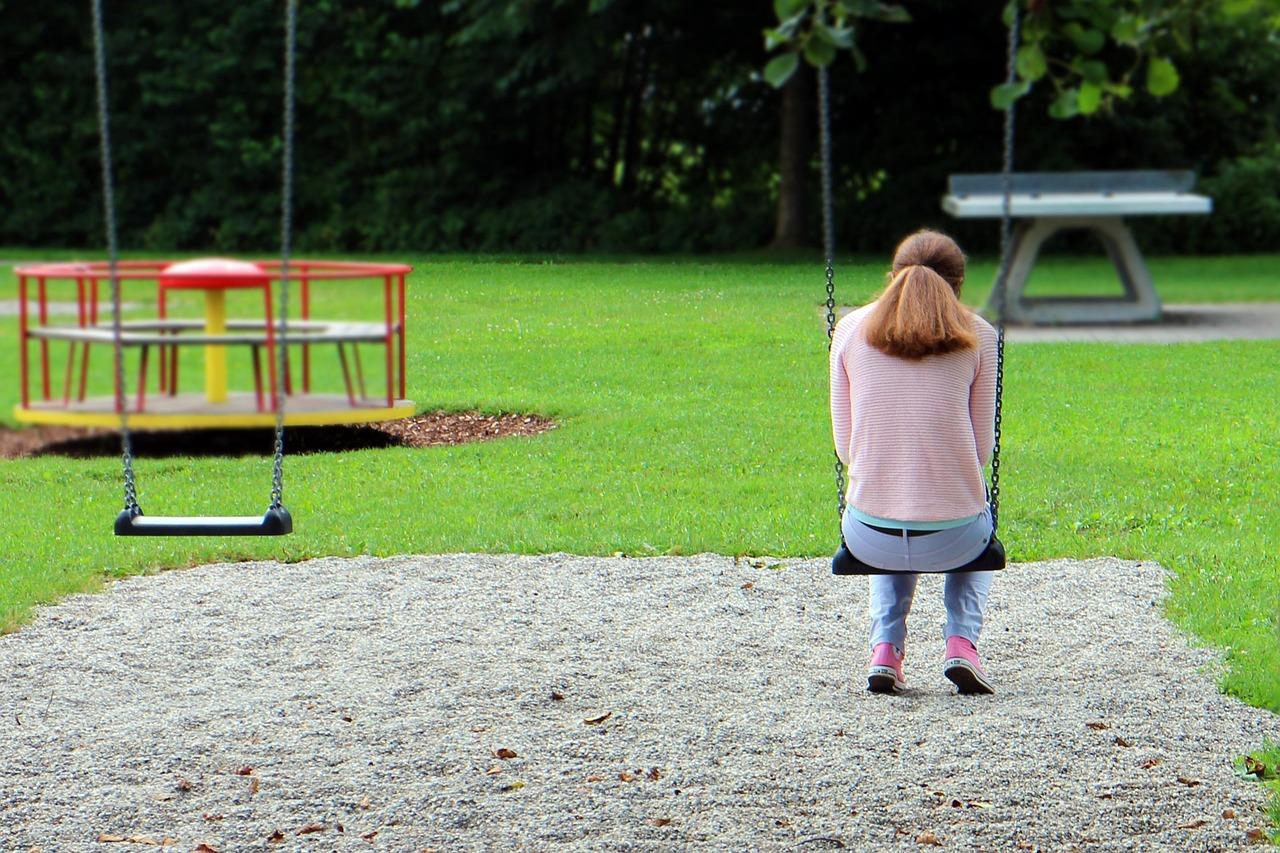 Young girl using a staple gun on material