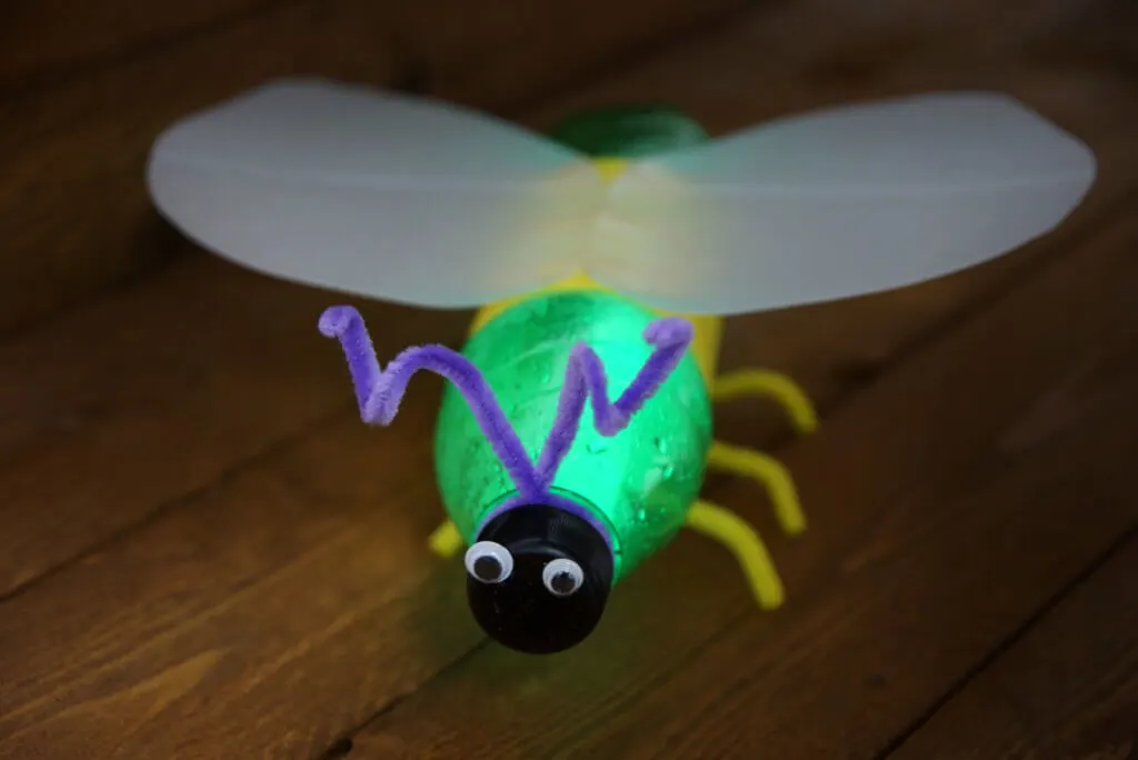A DIY glow bug made from plastic soda bottles, seen from above