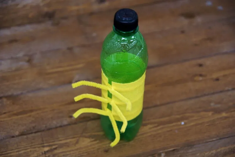 An old bottle being turned into a craft activity for kids